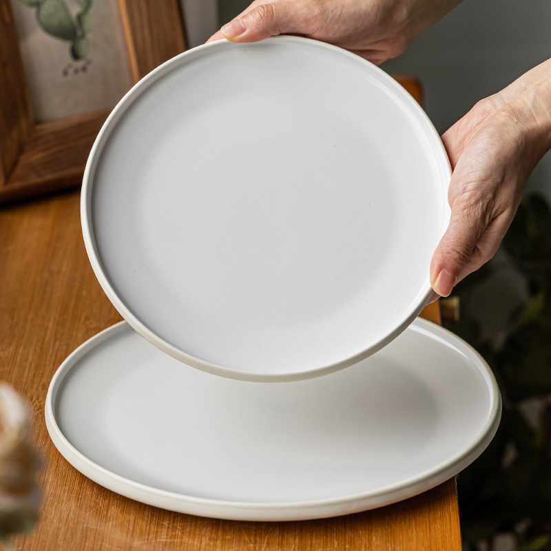 Plato plano de cerámica de estilo nórdico Plato redondo exquisito para el hogar Plato de carne occidental Plato de pasta Plato de vajilla Plato al por mayor