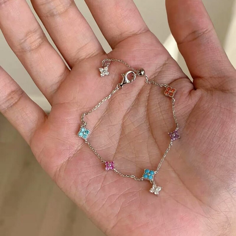 Japanese and Korean New Monet Garden Bracelet for Women, Four-Leaf Clover Zircon Inlaid Butterfly Hollow Tail Daily Women's Bracelet Wholesale