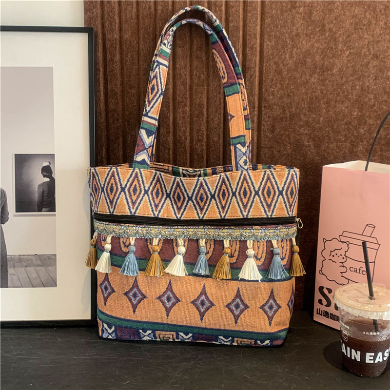 Bolsos de estilo nacional, bolsos de nicho, bolsos de hombro de estilo vacacional, bolsos de mujer, bolsos de primavera de 2025.