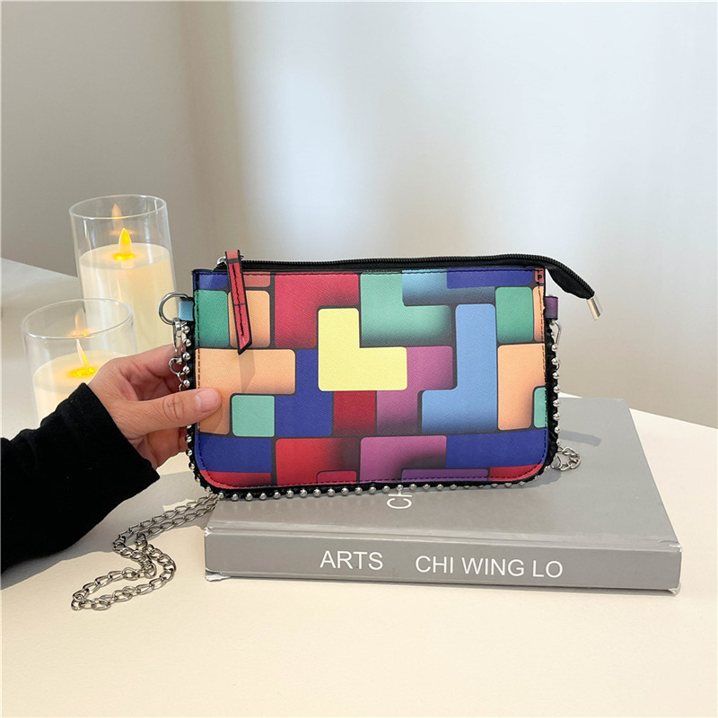 Personalidad de la tendencia de colores bolsos de mujer pintados 2025 nueva cadena de moda bolsos de mano simple bolsos de hombro de moda