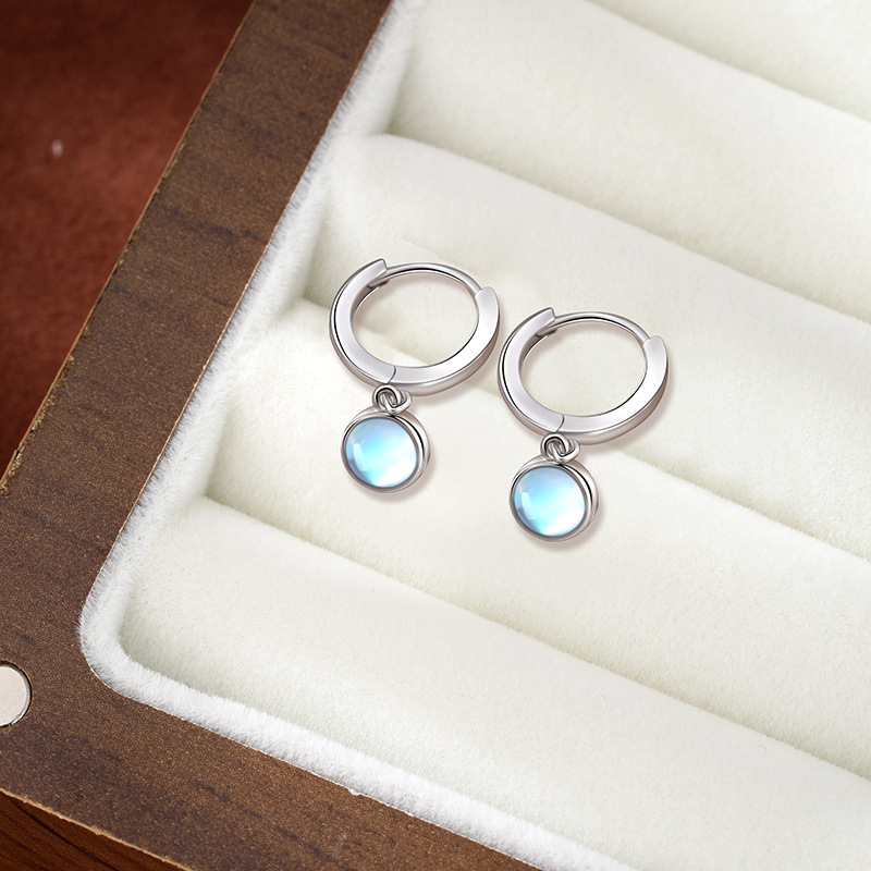 925 aretes de piedra de luna de plata esterlina círculo de alta calidad sencillo perfiles femeninos fríos temperamento europeo y americano pendientes transfronterizos