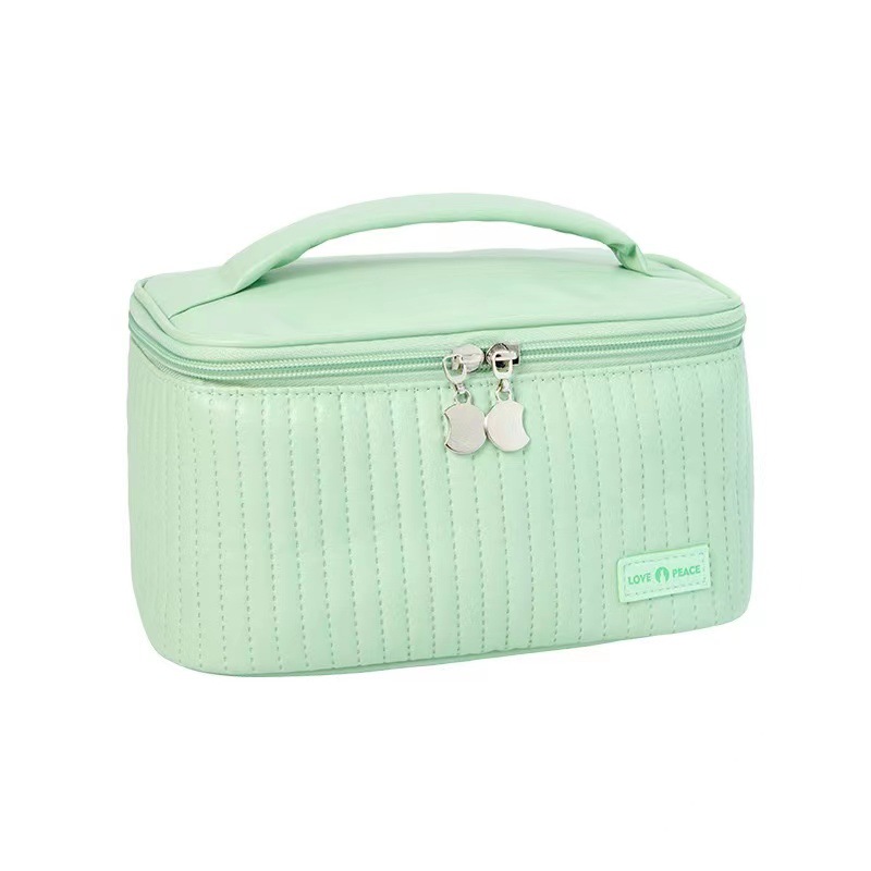 Nueva bolsa de maquillaje de pastel portátil portátil nicho de viaje de alto valor facial adorable bolsa de almacenamiento de cosméticos para productos de cuidado de la piel