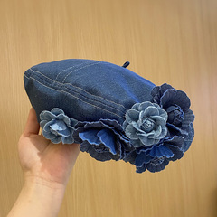 日本の小衆は色の立体の花のカウボーイのベレー帽の子供の潮が流行して顔が小さくてふわふわしている画家の帽子の新型を現します。
