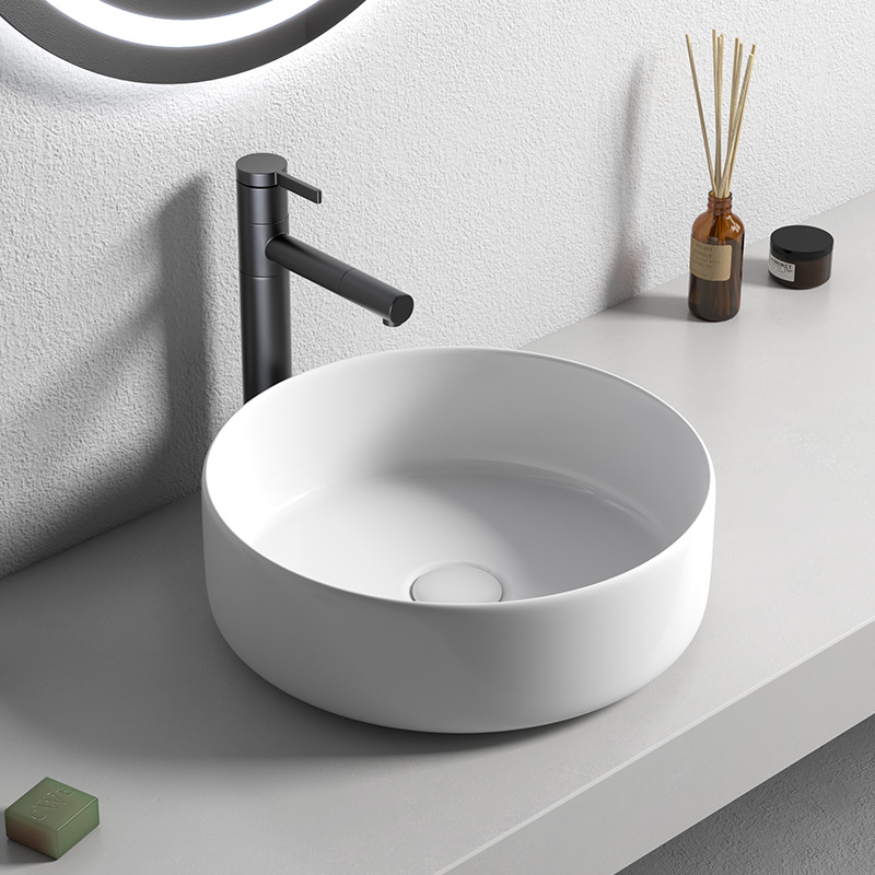 Nordic tamaño pequeño lavabo superior lavabo de cerámica del hogar pequeño tamaño de color redondo lavabo balcón creativo mini
