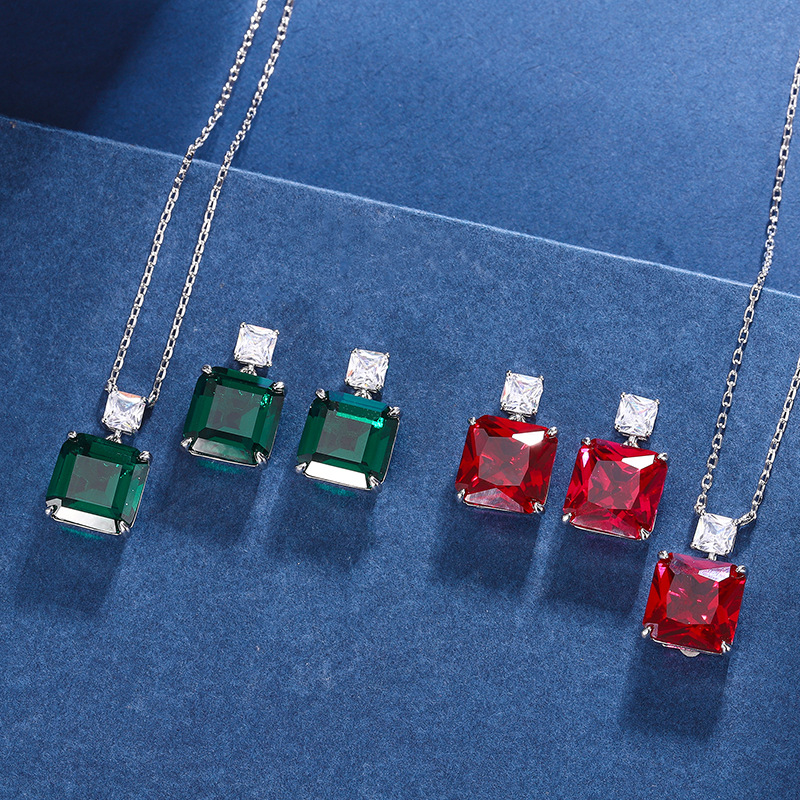 Zhuang Sheng joyería cobre inferior chapado en oro simulación paloma rojo sangre corindón verde nano nicho temperamento traje piedra principal 12*12