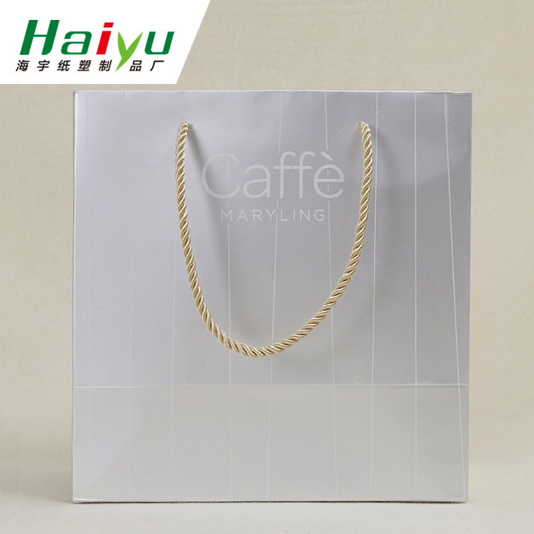 长期供应银色特种纸大号广告服装礼品购物袋制做包装手提纸袋