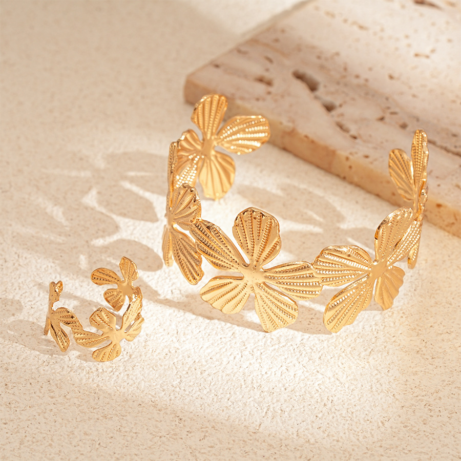 Pulsera abierta de flores con patrón de metal transfronterizo europeo y americano de dos piezas, temperamento de nicho simple, joyería de sentido avanzado para mujer