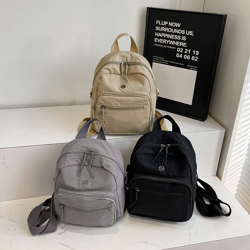 Mini mochila ligera coreana de moda casual mochila de viaje al aire libre de viaje de viaje simple mochila de estudiantes