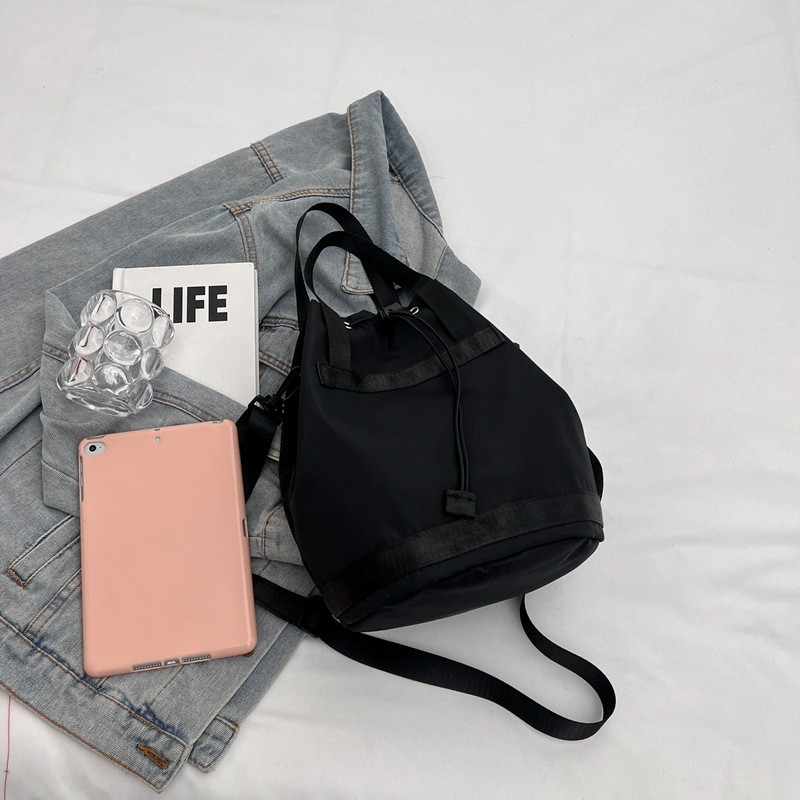 Fabricantes al por mayor 2024 primavera nuevas señoras bolso de cubo de nailon moda todo fósforo ligero bolso diagonal de un solo hombro bolso femenino