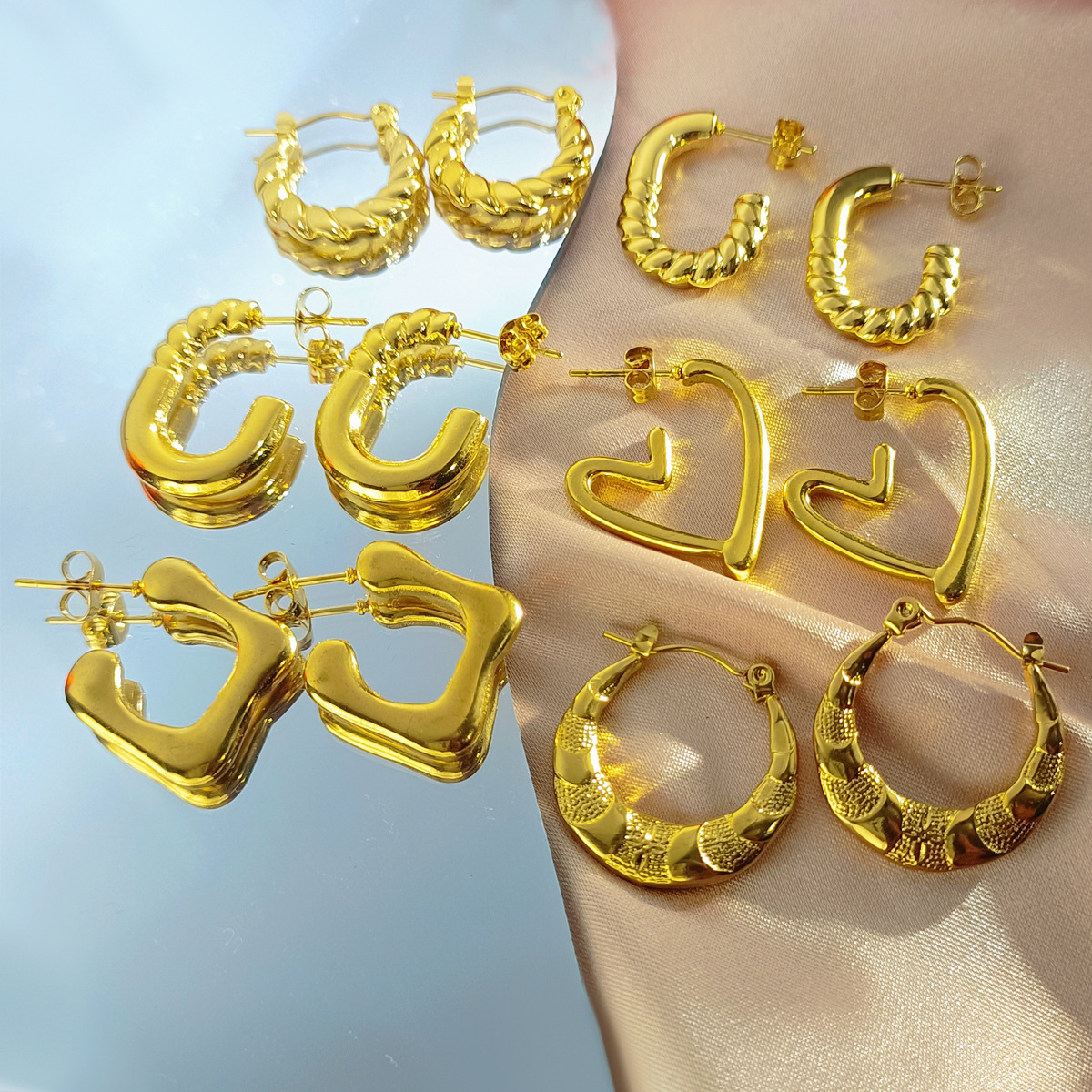 Cross-border best-selling oil-pressure stainless steel hollow earrings from Europe and America, high-end, trendy and light luxury style, 18K earrings wholesale 37 full figure