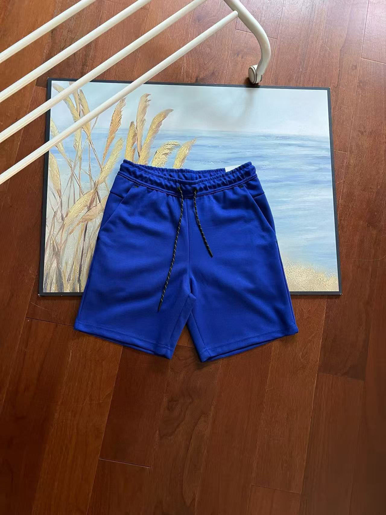 Verano nuevo estilo pequeño gancho versión en el extranjero de doce colores pantalones cortos deportivos de punto de pegamento lateral para hombres pantalones de cinco puntos 4503