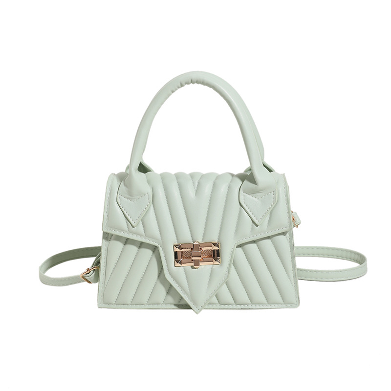 Textura 2025 nueva moda de impresión de estilo extranjero rotary-lock mochila de hombro casual color caramelo bolso de mano de mujer