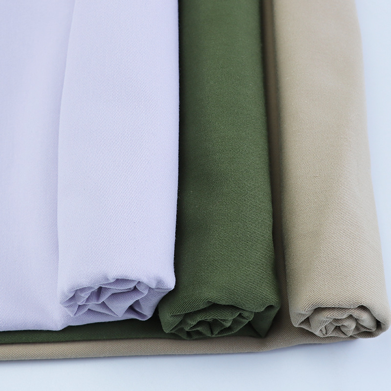 Algodón engrosado de alta densidad sarga lavada tela algodón fabricante en stock primavera y verano casual suspender pantalones overoles chaqueta tela