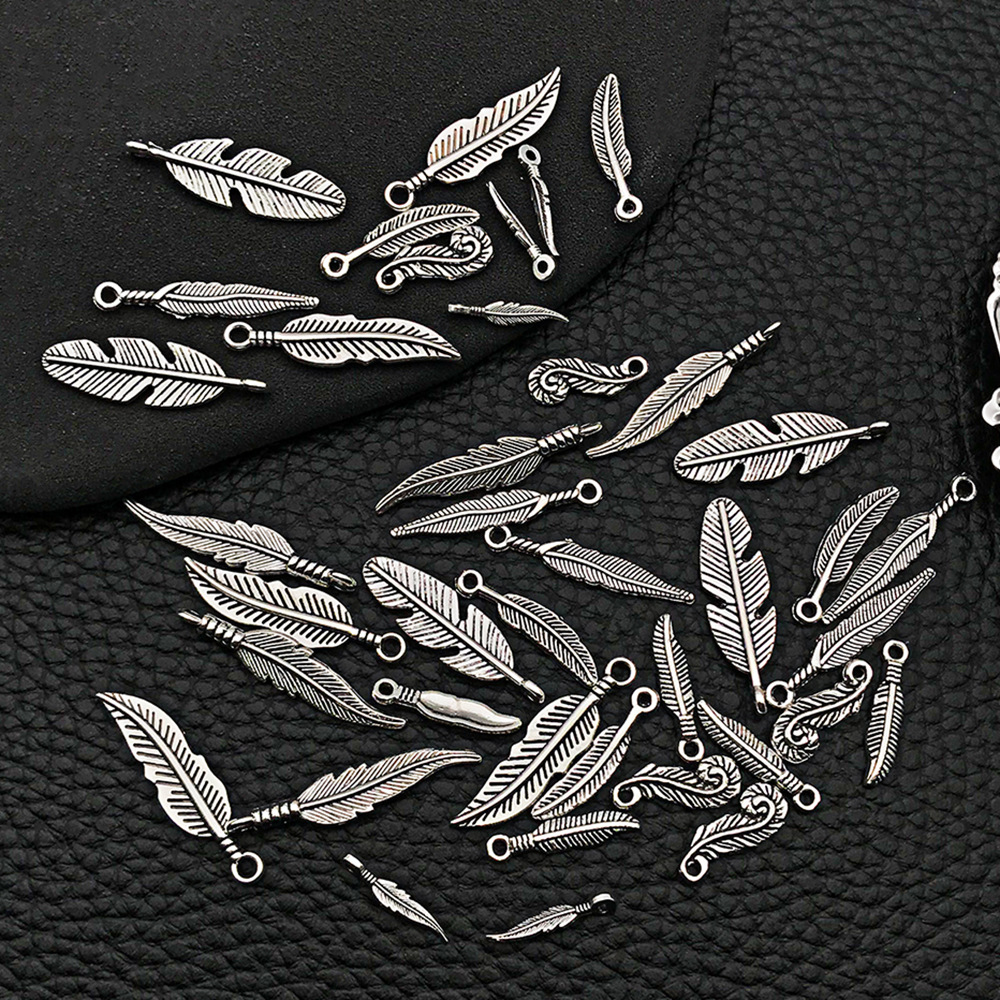 Venta caliente transfronteriza aleación retro hoja pluma collar pendiente colgante accesorios de joyería de bricolaje fábrica al por mayor