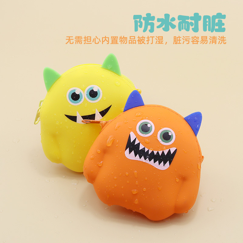 Monstruos de dibujos animados de silicona bolso de cambio de color caramelo cable de datos auriculares bolsa de almacenamiento portátil mini llave bolsa