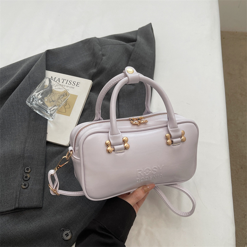 Bolsas de mano de moda populares para mujeres 2026 primavera nuevo estilo coreano sensación diaria bolsas de hombro para trabajar bolsas de viaje