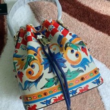 跨境女士手拿包欧美时尚真皮拼接手腕包帆布收纳包印刷手提水桶包