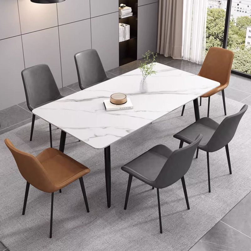 Mesa y silla de comedor de tabla de roca ligera de estilo italiano de lujo, combinación de mesa y silla de comedor de apartamento rectangular moderno y simple.