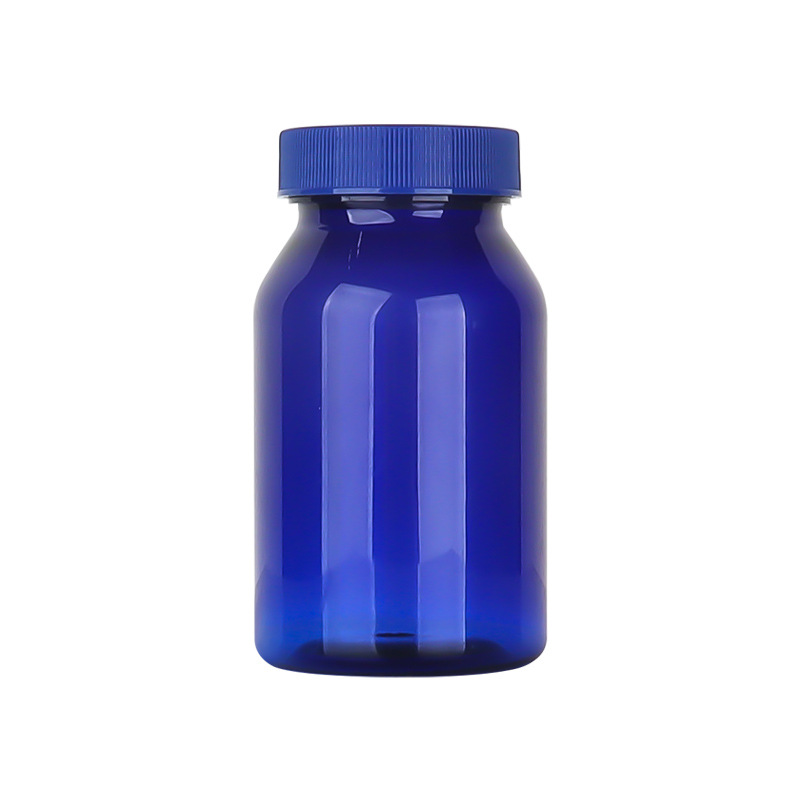 Botella de plástico azul 80–150 ml con tapa estriada, envase para suplementos o cápsulas.