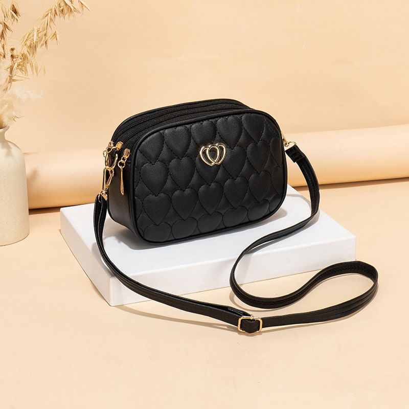 Gran capacidad de tres cremallera mochila 2024 nueva moda simple en forma de V diamante corazón bordado monocromático bolsa de cámara