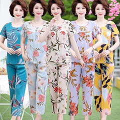綿のシルクの半袖のスーツの女性の夏の新型のファッションの外は家の洋風のゆったりしている2つのセットのお母さんの中高年を着ます。
