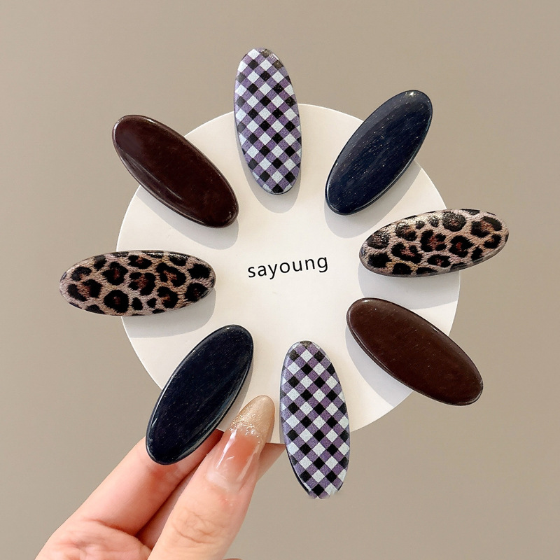 Temperamento Horquilla de ácido acético Horquilla rota lateral con estampado de leopardo 2025 Nuevo clip de pico de pato estilo retro de Hong Kong Tocado de horquilla simple
