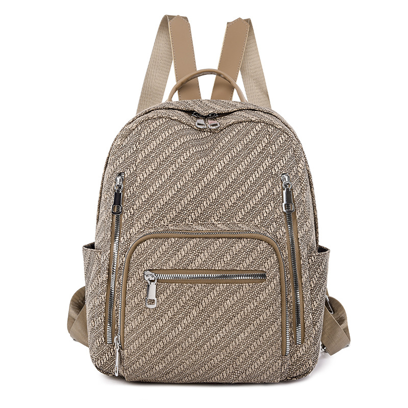 Ventas directas de fábrica 2024 primavera nueva mochila simple de color sólido para mujer mochila de viaje de gran capacidad para viajeros urbanos