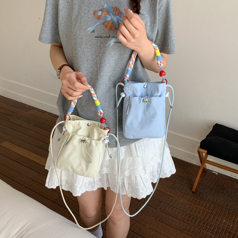 Spring and summer casual versatile nylon crossbody phone bag, lightweight small backpack for outings, simple and stylish coin and earphone bag