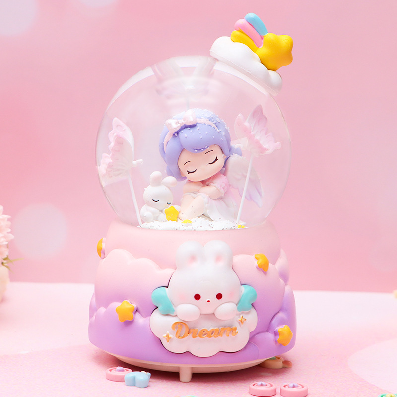 Dibujos animados creativo sueño mariposa bola de cristal caja de música nieve luminosa decoración de escritorio regalo de cumpleaños para niños al por mayor