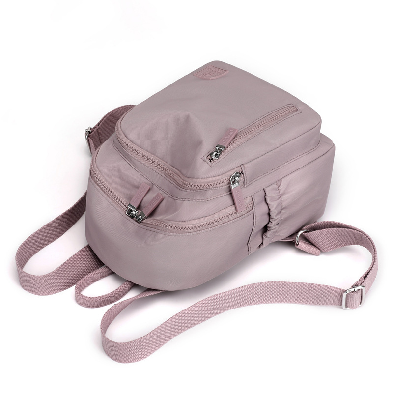 Mochila sencilla e informal para mujer, bolso portátil de gran capacidad para viajes y desplazamientos, mochila versátil de tela de nailon de gran capacidad para mujer