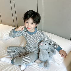 秋冬の新型子供のカシミヤのシルクの下着のスーツの男女の子供は骨がなくて厚い秋の服の秋のズボンの家庭服のパジャマを厚くします。