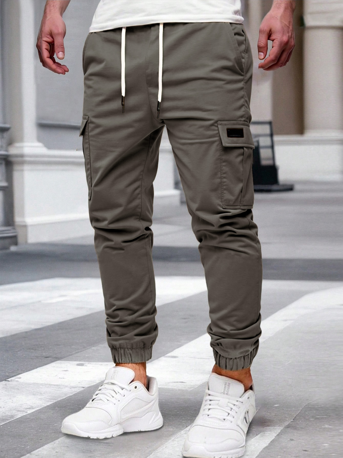 Nuevos pantalones de estilo europeo transfronterizo de hombre de bolsillo multi-bolsillo, pantalones de estilo de moda de comercio exterior.