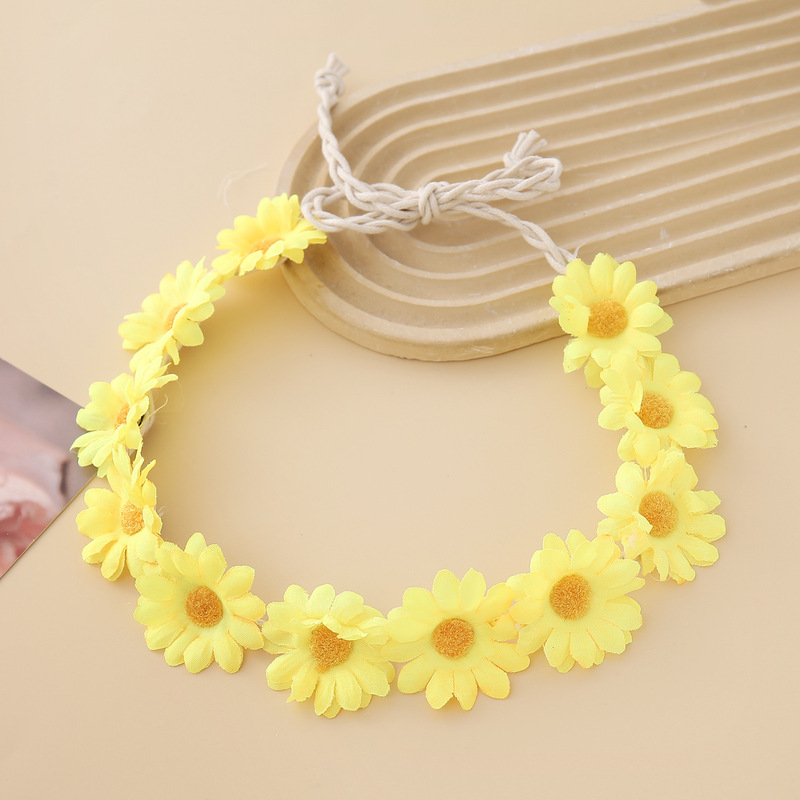女性の女の子のヘアバンドは11輪の花の頭を編んで小さい太陽の花を持って旅行します。|undefined