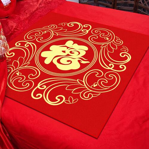 Bride sitting on the fortune cushion, the bride's side presents the auspicious bedding, wedding room decorated with hundred fortune cushions, wedding bed with red auspicious cushion.