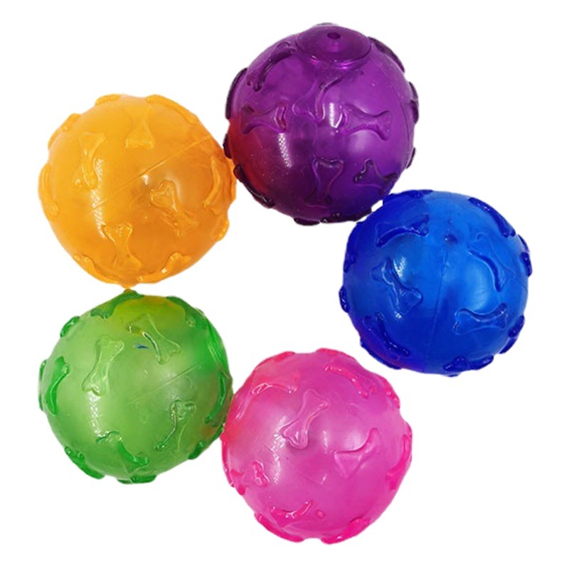 En stock al por mayor mascota flash bola juguete gato y perro LED luminoso sonido hueso bola TPR mordedura-resistente Limpieza de dientes bola elástica