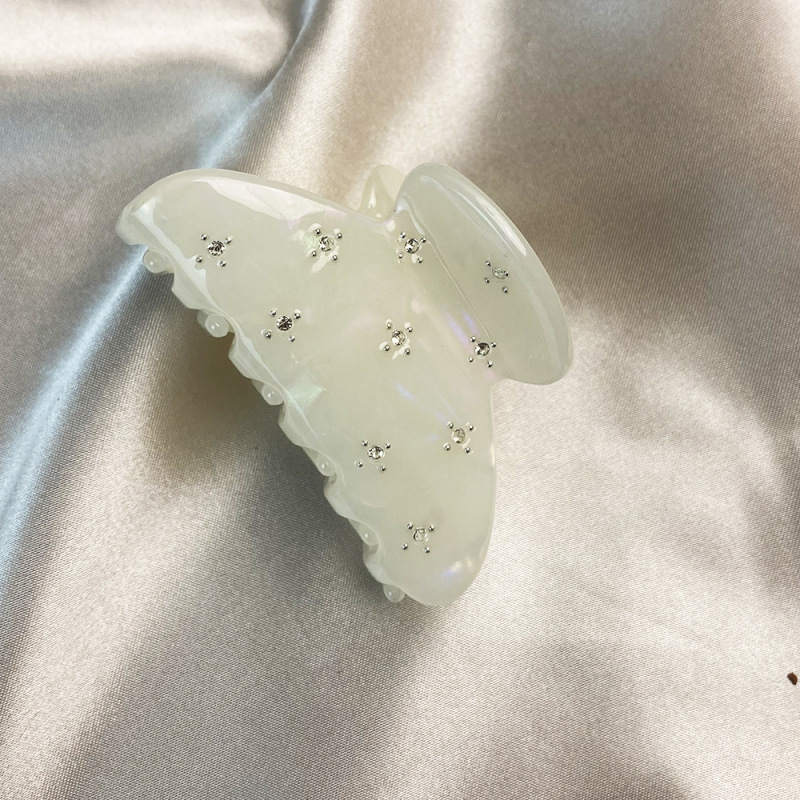 満天の星の水のドリルの半円はかわいい王女のトップを挟んで半分にポニーテールの女性の髪を挟んで高級な気質の酢酸を挟みます。|undefined