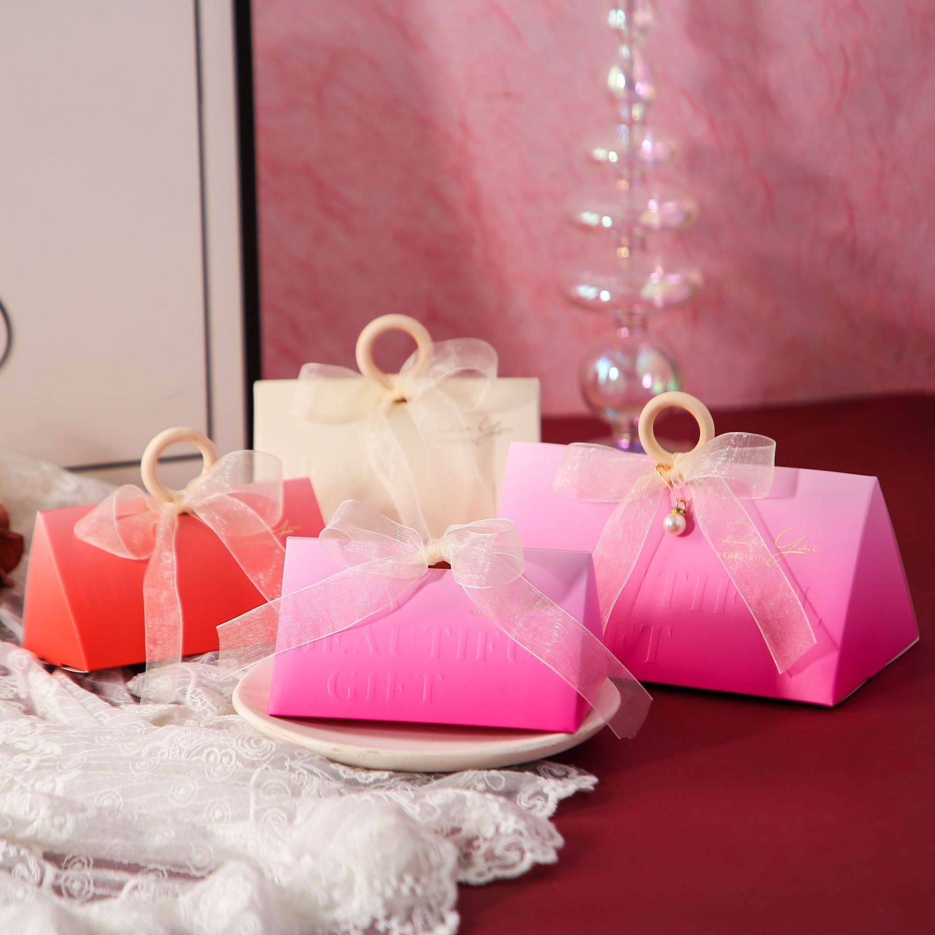 New triangular, fresh wedding gift box in gradient rose-red folding style, portable and easy to store.
