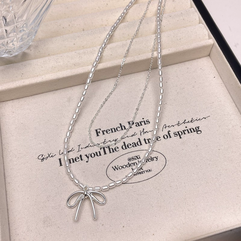 Серьга/П pendant from pearl with bow?