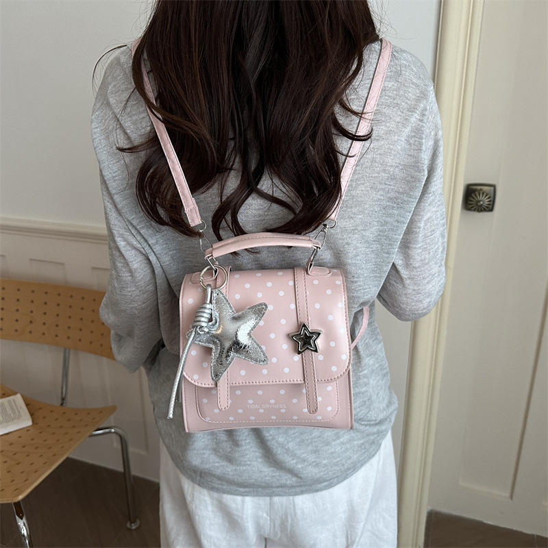 Bolsa de hombro coreana de estilo universitario de ondas 2026 nueva moda simple versátil mochila de mano de viaje