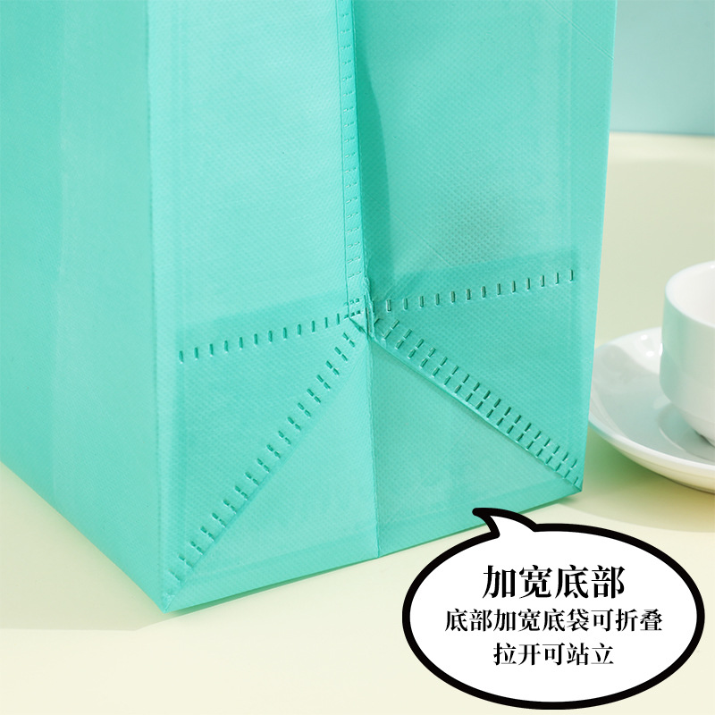 En stock bolso no tejido recubierto al por mayor bolsa de protección del medio ambiente bolsa de tienda de ropa bolso de compras engrosado logotipo imprimible