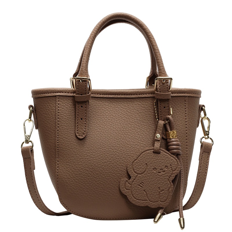 Bolsa de cubo portátil de comercio exterior 2025 nuevo bolso de mochila de textura universal nicho de diseño de red de popularidad explosiva bolso de hombro