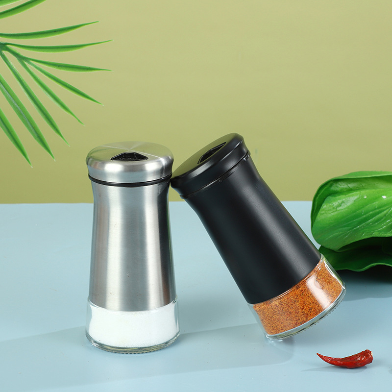 Fábrica al por mayor botella de condimento de vidrio de acero inoxidable cocina esparcidor de pimienta porosa giratoria sal de mar