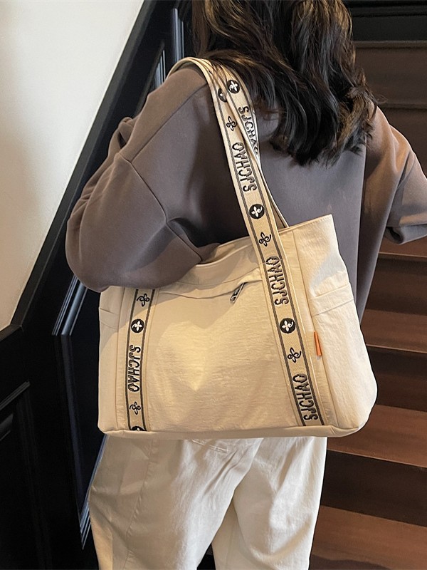 Bolso Tote portátil horizontal de tela de nailon para mujer 2025 nueva moda casual todo fósforo bolso de hombro de trabajo