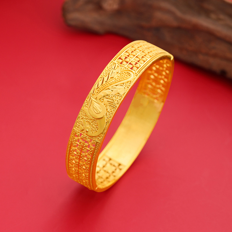 Hueco tallado flor pulsera patrón de pavo real estilo antiguo elegante todo partido pulsera de aleación de cobre hembra Venta caliente suministro directo de fábrica al por mayor