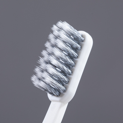 RAOYI new black and white spiral bristle toothbrush tongue scraping brush combination adult household soft bristle toothbrush manufacturer wholesale