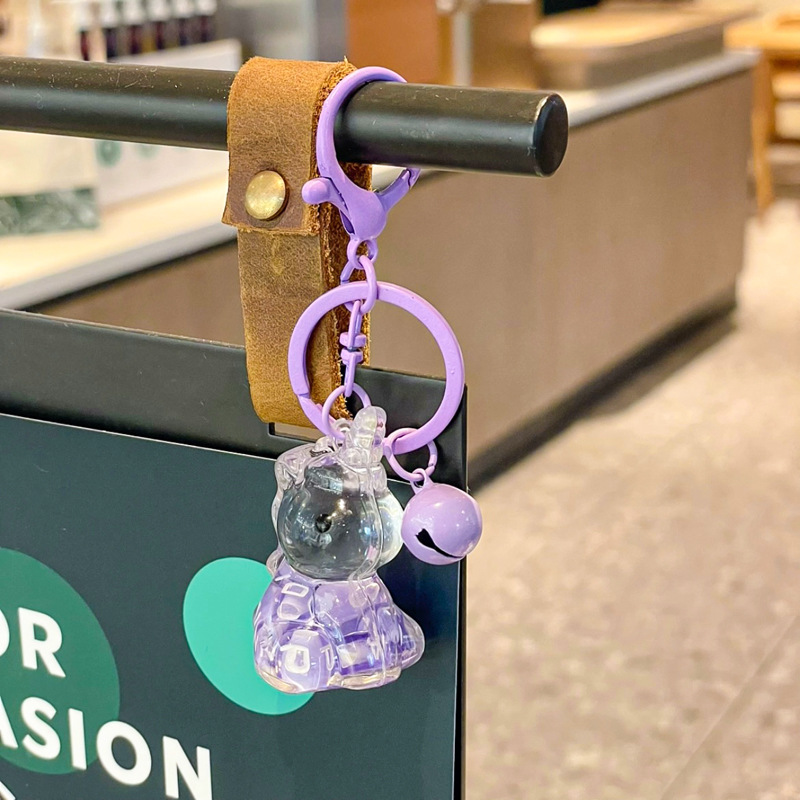 Caricatura en aceite líquido arena flotante botella mochila llavero delicado colgante accesorios accesorios máquina de muñecas pequeños regalos al por mayor