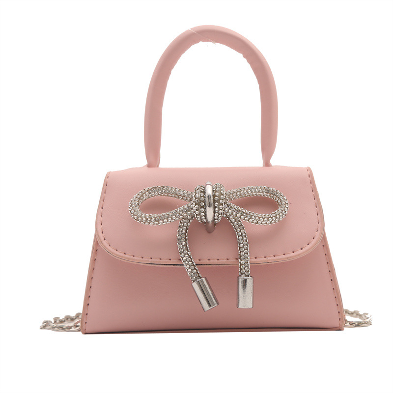 Alta textura estilo Chanel color sólido arco pequeño cuadrado bolso de las mujeres 2023 invierno nueva cadena crossbody del hombro