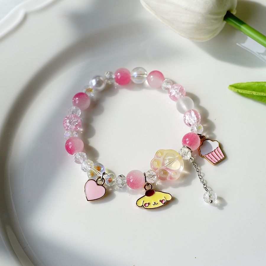 thumbnail image 1 of La nueva versión coreana de la caricatura Mori con cuentas de cristal canela perro pudín perro pulsera gato garra mano joyería pudín perro uno, 1 of 2