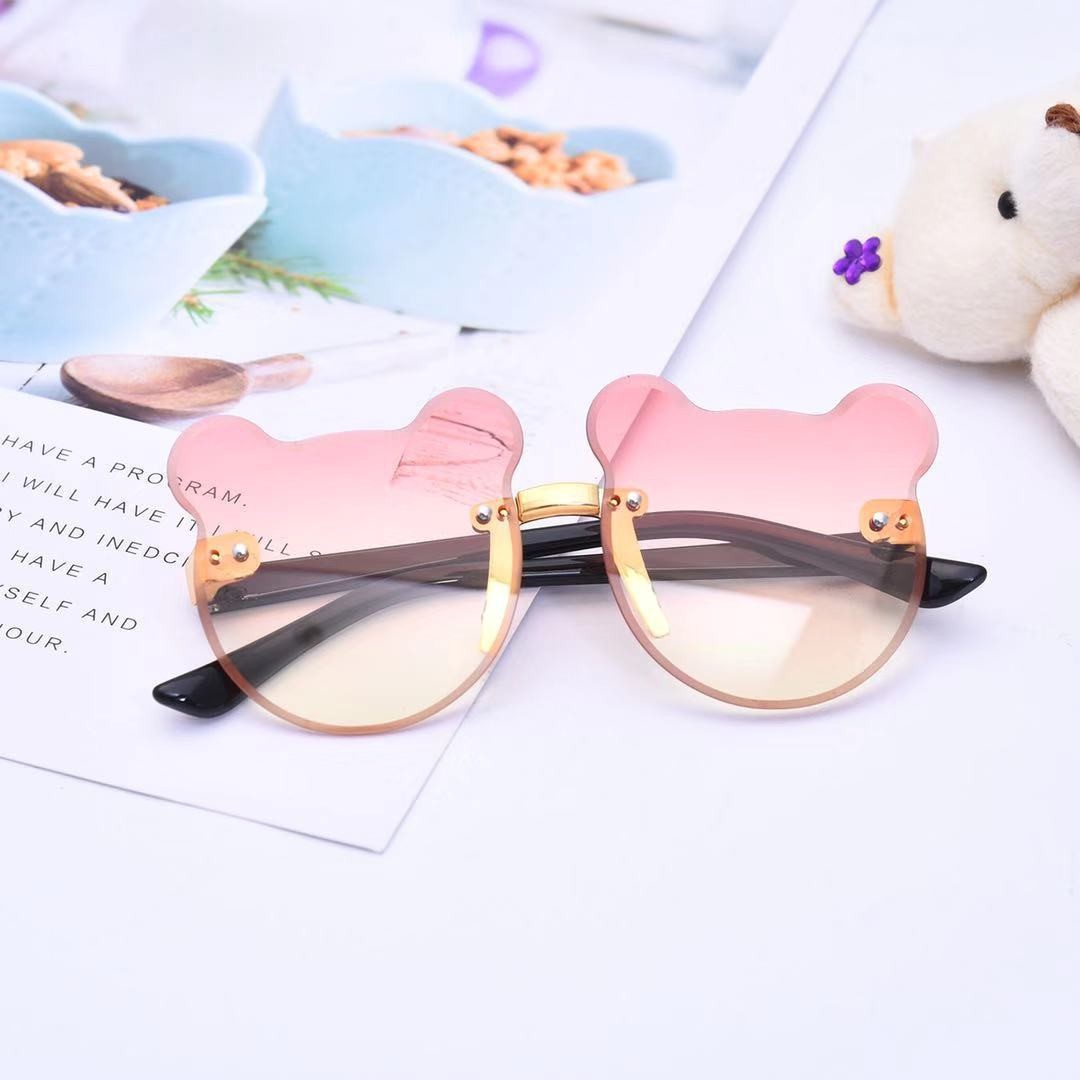 Nuevo oso gafas de sol de los niños raqueta de calle vanguardia moda calle raqueta copia pieza sin marco chica gafas de sol fábrica al por mayor