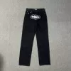 Black denim trousers